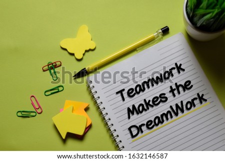Teamwork Makes The Dreamwork write on a book isolated on office desk.