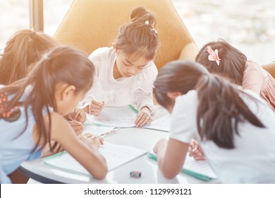 Teamwork. Nice Little Kids Making Notes And Studying Together While Working In A Group