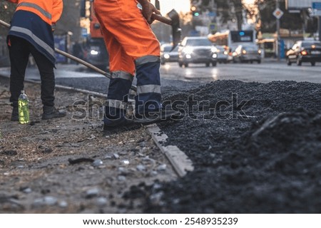 Teamwork on road construction. Men at work.
