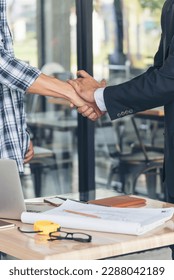 Teamwork partner two men team shaking hands together. Businessman contractor handshake with Business Partner Trust Partnership. Industrail people contractor dealing mission team meeting office desk