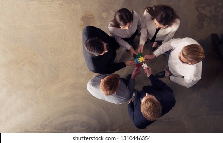Teamwork of partners. Concept of integration and startup with puzzle pieces - Shutterstock ID 1310446354