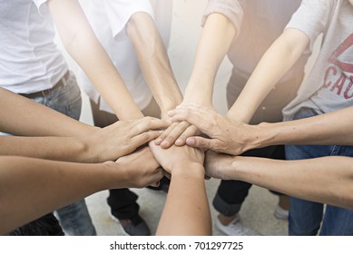 Teamwork people touch hands for unity group to succuss business. - Shutterstock ID 701297725