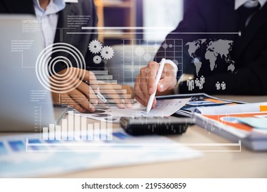 Teamwork process, Business team using a calculator to calculate the numbers of statistic business profits growth rate on documents graph data, desk in the office.