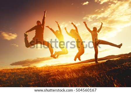 Teamwork success concept with group of jumping friends