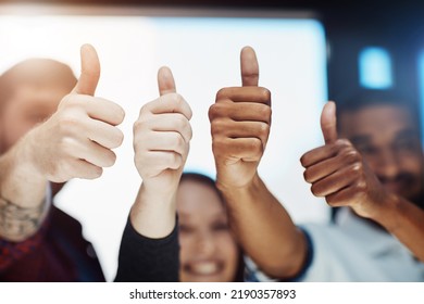 Teamwork, support and trust with a thumbs up from happy colleagues collaborating. Excited partners uniting, showing trust and success with a winning gesture. Community working together towards a - Shutterstock ID 2190357893