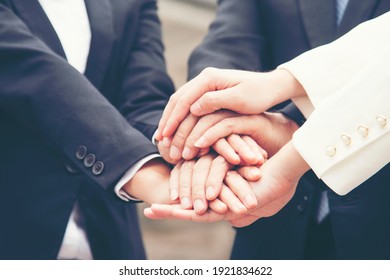 Teamwork Together Concept. Group of diversity people high five on air to greeting power of tag team. Multiethnic people group working togetherness. Volunteer collaboration in Business Team success - Powered by Shutterstock