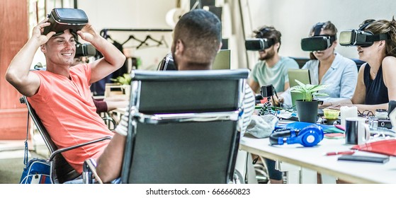 Teamwork trying virtual reality glasses for work in creative office - Young people using new technology at startup - Focus on left man headset - Trends , social and business concept - Contrast filter - Powered by Shutterstock