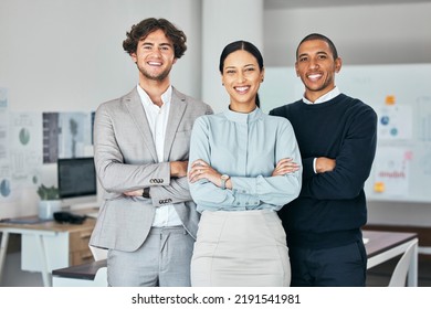 Teamwork, Unity And Togetherness With A Corporate Team Portrait Of Colleagues Standing Arms Crossed In Their Office At Work. Young, Motivated And Ambitious Business People With A Mindset Of Growth