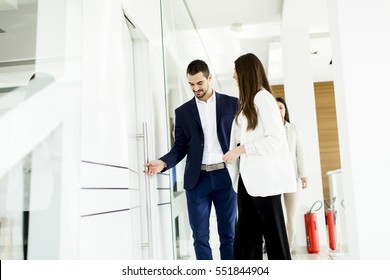 Teamwork Walking At Door In The Office