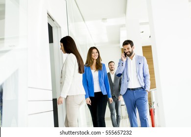 Teamwork Walking At Door In The Office