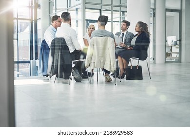 Teamwork, working together and development with a group or team of business people, colleagues and coworkers in the office. Talking, planning and discussing strategy during a workshop or seminar - Shutterstock ID 2188929583