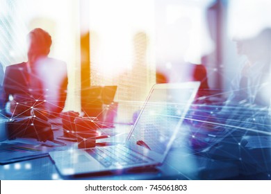 Teamwork works with a laptop. Concept of internet sharing and interconnection. double exposure - Shutterstock ID 745061803