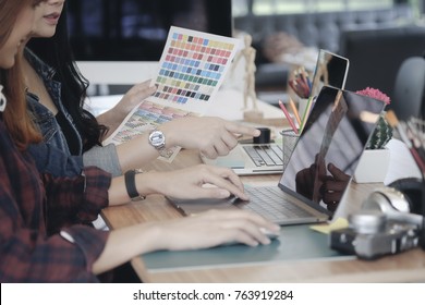 Teamwork,brainstorming concept. Creative designer at the workshop. Young creative design team working with new startup project in modern office. - Powered by Shutterstock