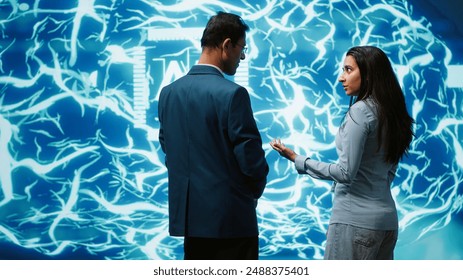 Teamworking colleagues implementing artificial intelligence parallel processing, breaking up complex computational tasks enabling AI systems to process more input data faster, camera A - Powered by Shutterstock - Get 15% off with code: PIKWIZARD15