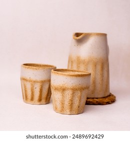 teapot set with two white cream begrone glasses made from ceramic - Powered by Shutterstock