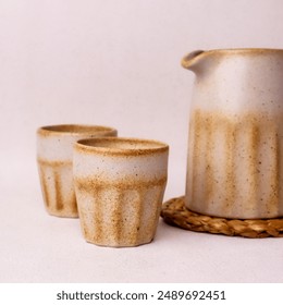 teapot set with two white cream begrone glasses made from ceramic - Powered by Shutterstock