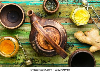 Teapot with tea from ginger,honey and lemon.Vitamin, healing tea.Alternative medicine