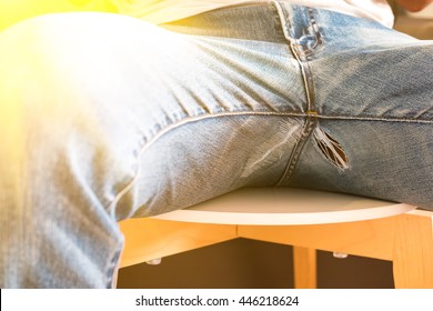 Tear of jean pants at crotch area 