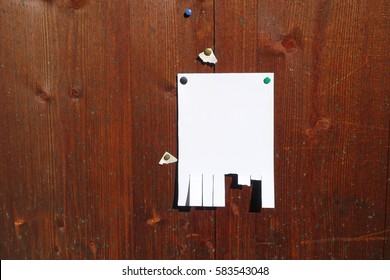 Tear Off Paper On Wooden Background