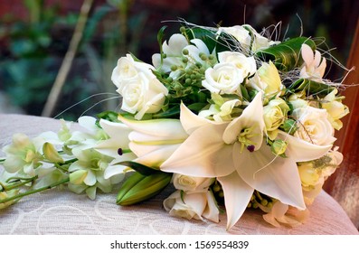 Teardrop Bridal Bouquet Of White Oriental Lilies, Roses, Orchids And Brunia Berries. Wedding Flowers. 