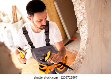 Tearing Down The Concrete Wall Observed From The Ceiling View  