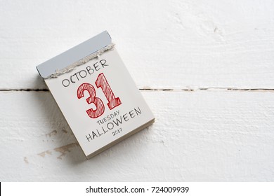 tear-off calendar with october 31st, date of Halloween, on top - Powered by Shutterstock