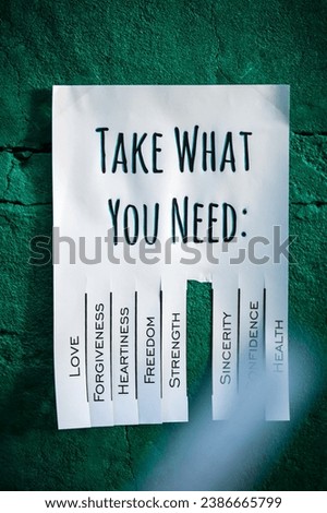Tear-off stub note with text 'Take what you need' on emerald background. One wish is torn off.