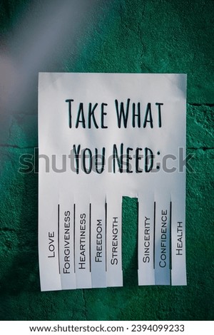 Tear-off stub note with text 'Take what you need' on emerald background. One wish is torn off.