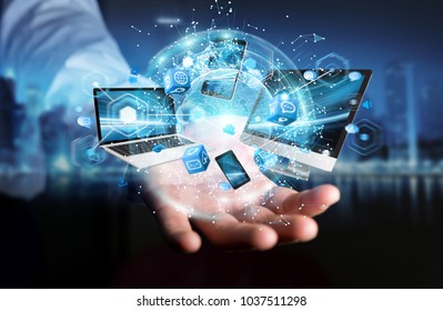 Tech devices connected to each other by businessman on blurred background 3D rendering - Shutterstock ID 1037511298