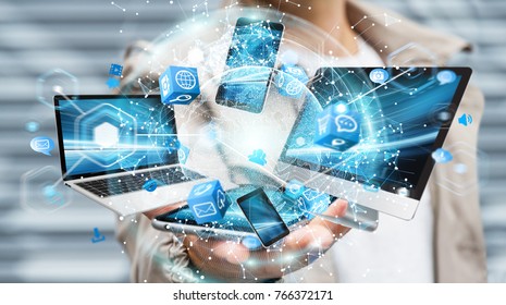 Tech devices connected to each other by businessman on blurred background 3D rendering - Shutterstock ID 766372171
