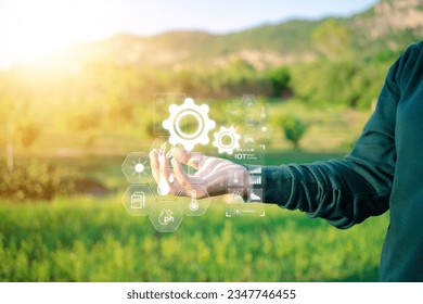 Tech Enhanced Agriculture Hand Holding Icon on Virtual Screen for Managing Farm Functions - Shutterstock ID 2347746455