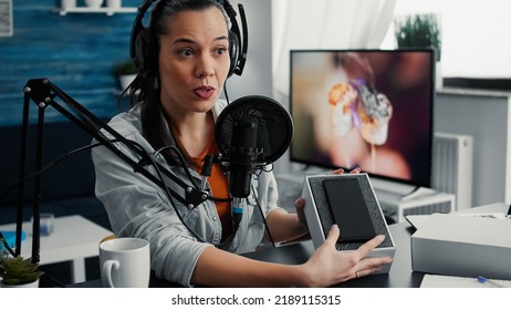 Tech Enthusiast Doing Unboxing Review Video Of Modern Smartphone While Presenting Specifications To Audience. Content Creator Unpacking Touchscreen Mobile Phone While Doing Recommendation Video.