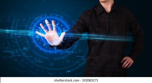 Tech guy pressing high technology control panel screen concept 