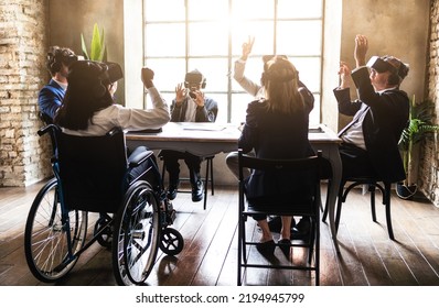 Tech And Innovative Company Working With Vr Glasses And Interacting With Their Clients In Metaverse - Back View Of Group Of Business Person Brainstorming On A Eco Sustainable Project 