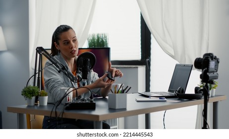 Tech Product Reviewer Unboxing Wireless Modern Mouse While Presenting It To Audience. Internet Influencer Doing Recommendation Video For Electronic Device While Sitting At Home Studio Desk.