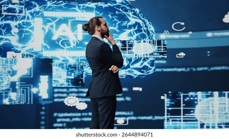 Tech savvy businessman employing AI brain data visualization, exploring algorithmic thinking and machine learning through neural networks system. Virtual intelligence in the digital age. Camera B.