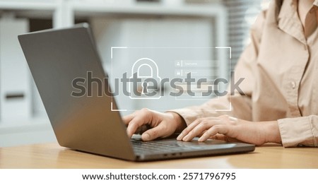 Tech security database attack. confidential data secure crime cyber protect. A woman is typing on a laptop with a security lock icon on the screen. Concept of caution and security.