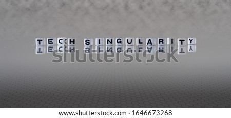 tech singularity concept represented by black and white letter cubes on a grey horizon background stretching to infinity