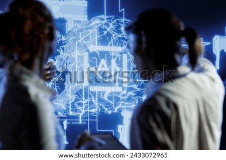 Tech support brainstorms ways to use AI cognitive computing to extract usable information from complex data. Server farm employees implement artificial intelligence to process inference datasets