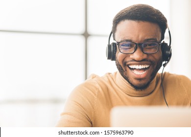 Tech Support. Portrait Of Handsome Black Sales Manager With Headset Working In Call Center. Empty Space