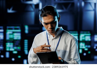 Tech support worker between server hub clusters providing processing resources for businesses worldwide. Overseeing supervisor fixes data center mainframes used for managing massive databases