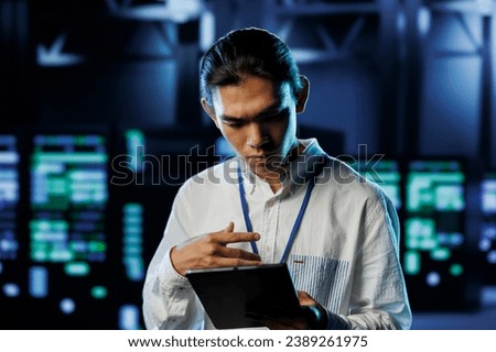 Tech support worker between server hub clusters providing processing resources for businesses worldwide. Overseeing supervisor fixes data center mainframes used for managing massive databases