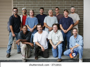 Technical College Class Photo Of A Group Of Handsome Blue Collar Working Men.  Diverse Ages And Ethnicities Represented.