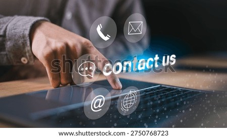 Technical consultant using laptop with virtual contact icons including phone, message, email and globe. Online support system, digital communication network, customer service center