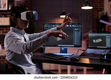 Technical developer engineering machine product, working with vr glasses and cad software on monitor. Developing engine component with virtual reality goggles for industry manufacture. - Shutterstock ID 2204856213