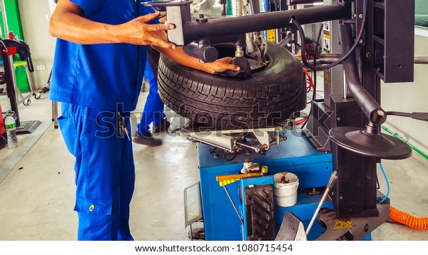 technical\
during tire assembler in tire service\
center