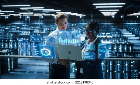 Technical Engineer and Project Administrator Using Computer in Modern Data Center Server Room Facility. Augmented Reality Productivity and Corporate Business Data Icons Appear From Worker's Laptop. - Powered by Shutterstock