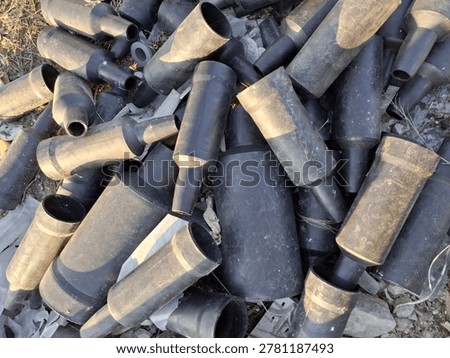 Technical garbage made of black plastic at the junkyard