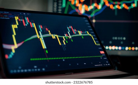 Technical price graph and indicator, red and green candlestick chart on blue theme screen, market volatility - Powered by Shutterstock