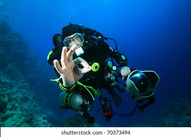 Technical Scuba Diver with Rebreather and SLR Camera